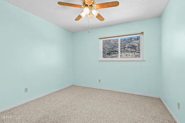 a view of a dinning table and chairs in the patio