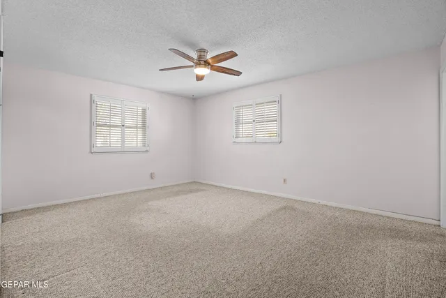 a front view of a house with swimming pool and porch