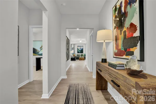 a view of hallway with wooden floor