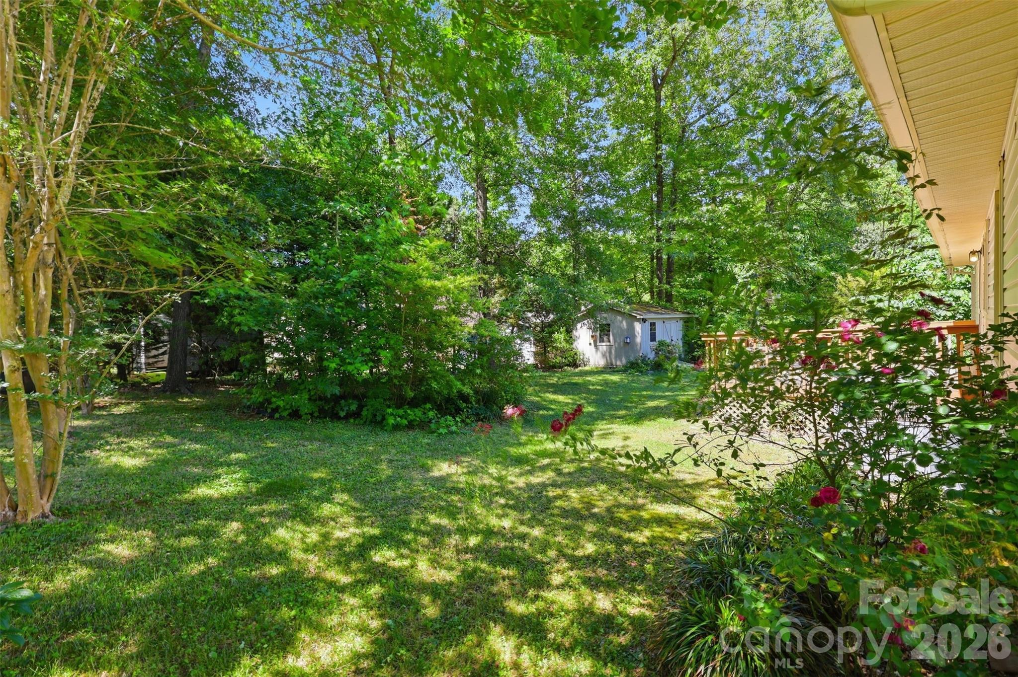 913 Pleasant Ridge Road Fort Mill, SC 29715 - Photo 26 of 40 a backyard of a house with lots of green space and garden view