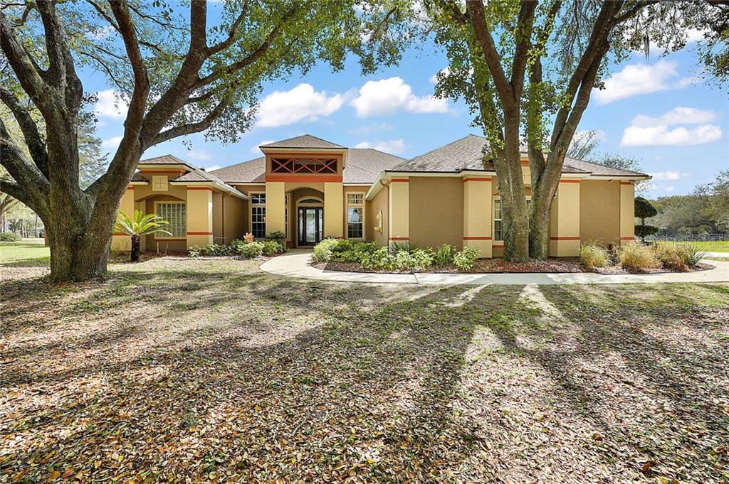 28131 Lake Jem Road Mount Dora, FL 32757 - Photo 1 of 1 Front Exterior with Majestic Oaks