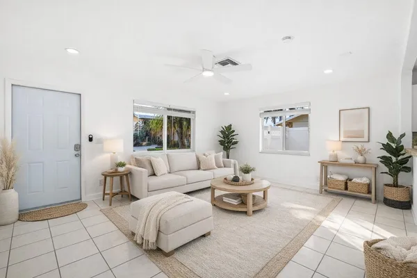 a living room with furniture and a window
