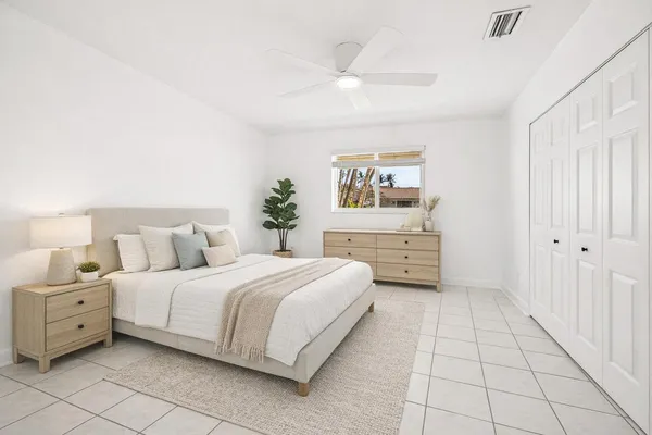 a bedroom with a bed and a cabinets