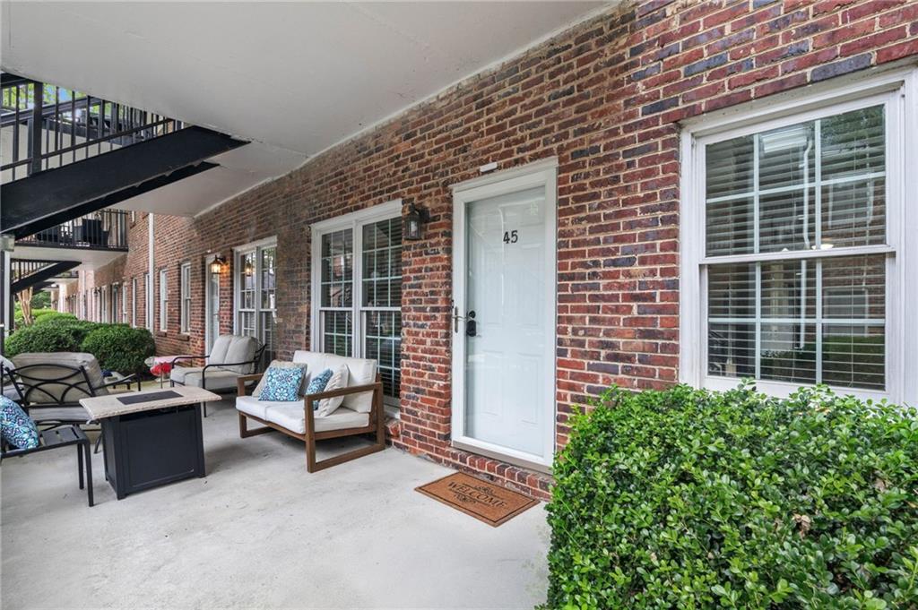 3675 Peachtree Road Northeast, Unit 45 Atlanta, GA 30319 - Photo 3 of 42 a building outdoor space with patio furniture and potted plants