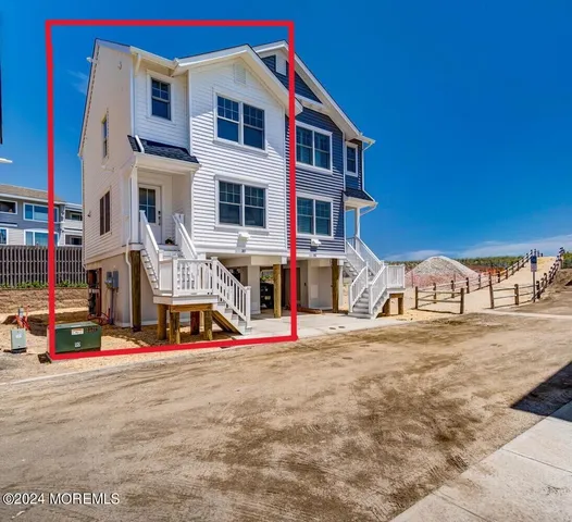 a aerial view of a house with a ocean view