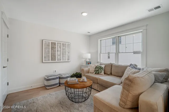a kitchen with a refrigerator and microwave