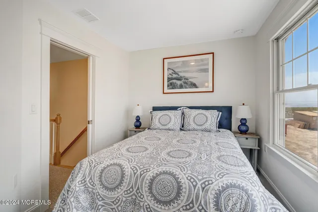 a bedroom with a bed and a cabinets