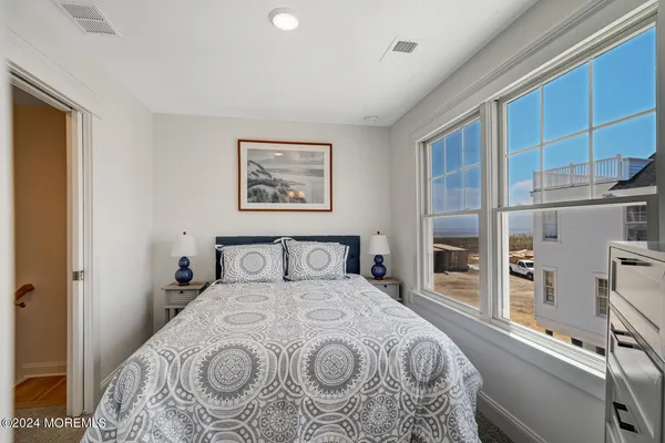 a view of a bedroom with closet and cabinet