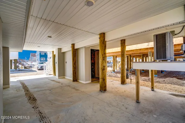 a living room with furniture a rug and a window