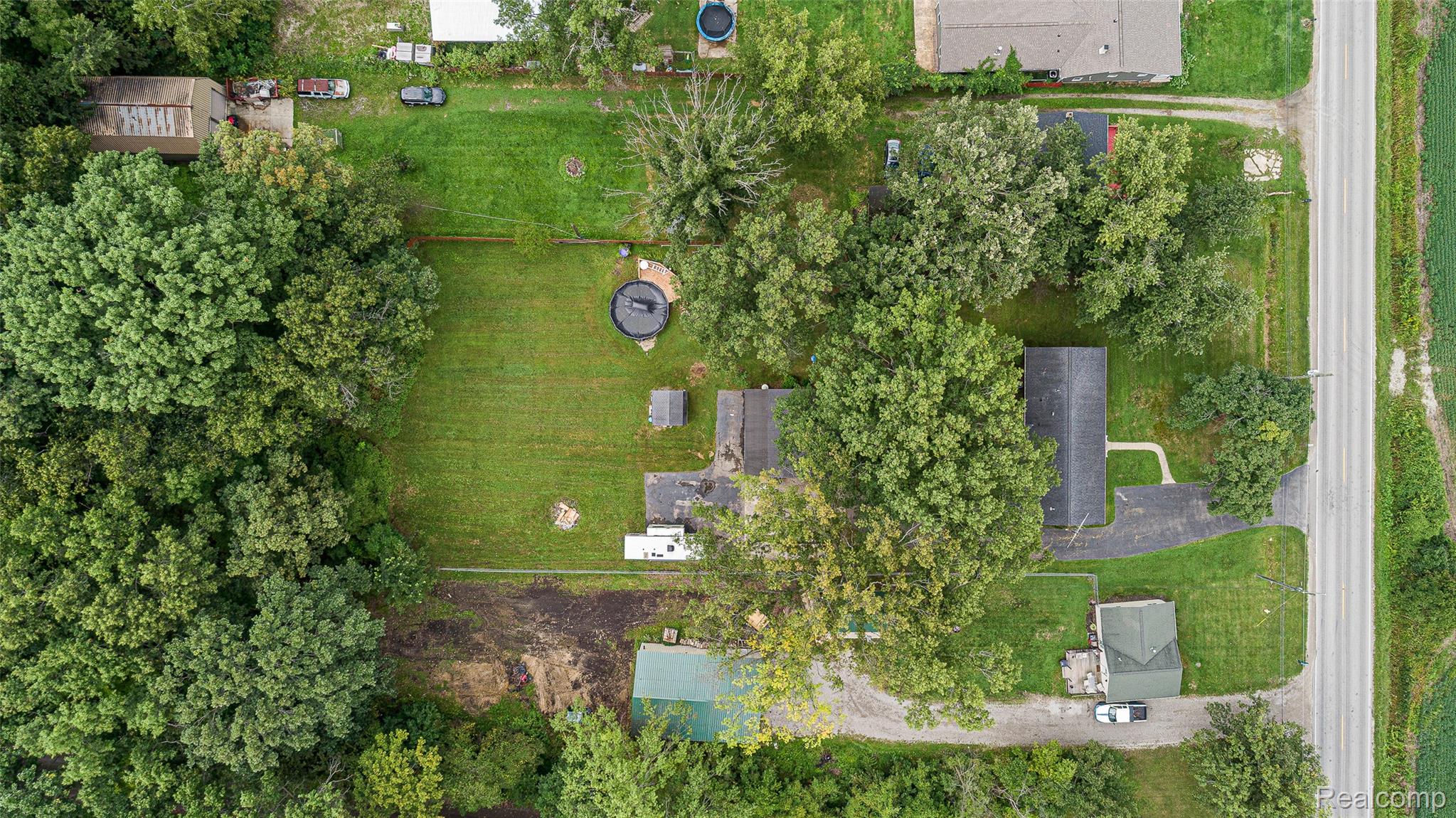 9561 Exeter Road Carleton, MI 48117 - Photo 6 of 46 Expansive property featuring mature trees and a substantial grassy area