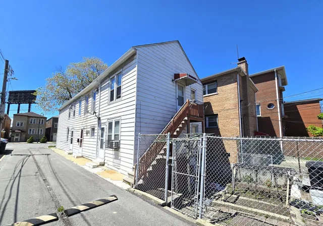 a view of a house with wooden deck