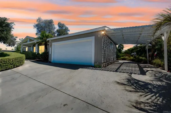 a backyard of a house with yard and garage
