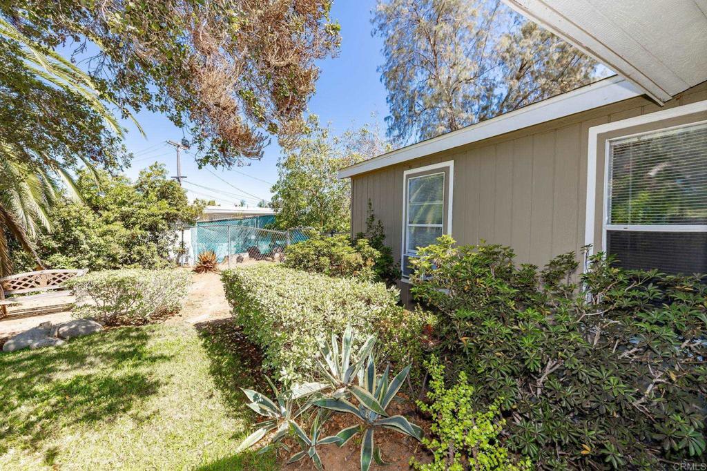 224 Astro Court Vista, CA 92083 - Photo 11 of 47 a view of a yard with plants and large trees