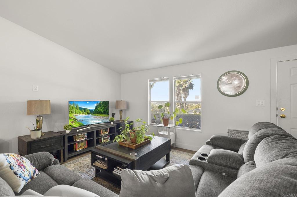 224 Astro Court Vista, CA 92083 - Photo 17 of 47 a living room with furniture and a flat screen tv