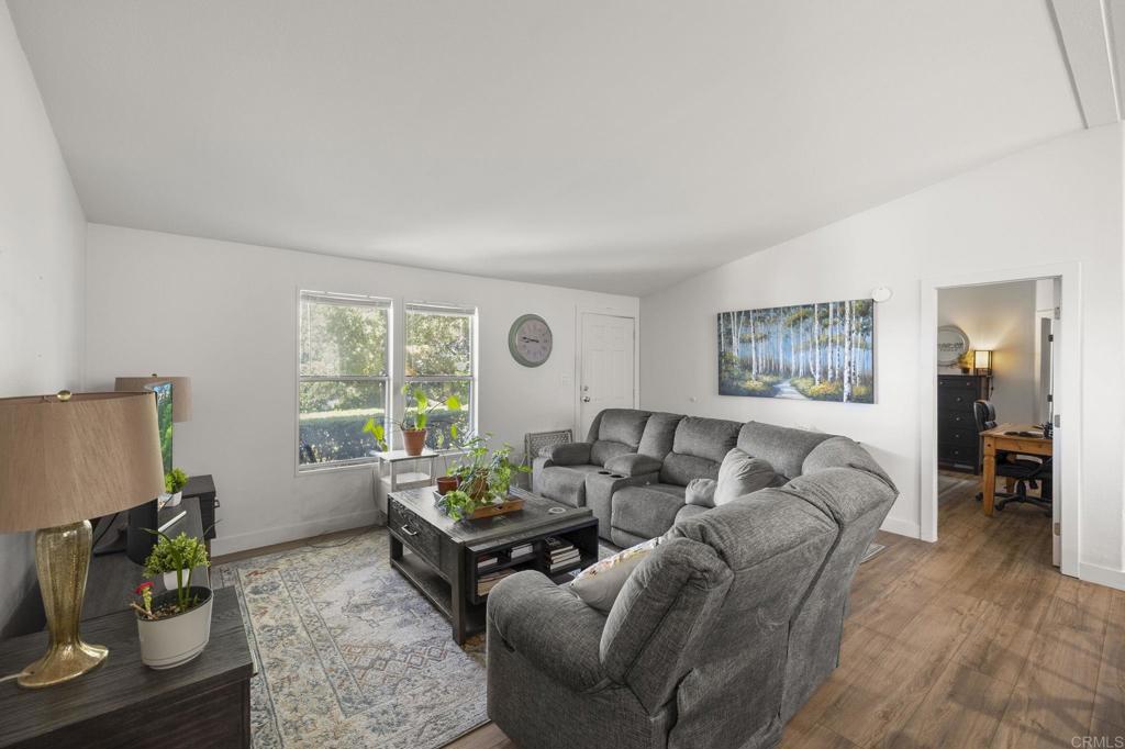 224 Astro Court Vista, CA 92083 - Photo 18 of 47 a living room with furniture and a flat screen tv