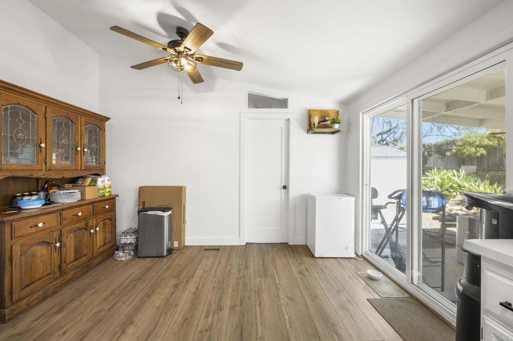224 Astro Court Vista, CA 92083 - Photo 30 of 47 a view of kitchen with furniture wooden floor and a ceiling fan