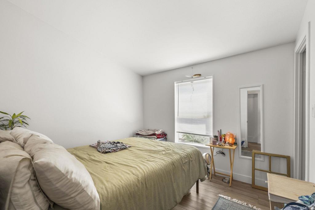 224 Astro Court Vista, CA 92083 - Photo 34 of 47 a bedroom with a bed and a window