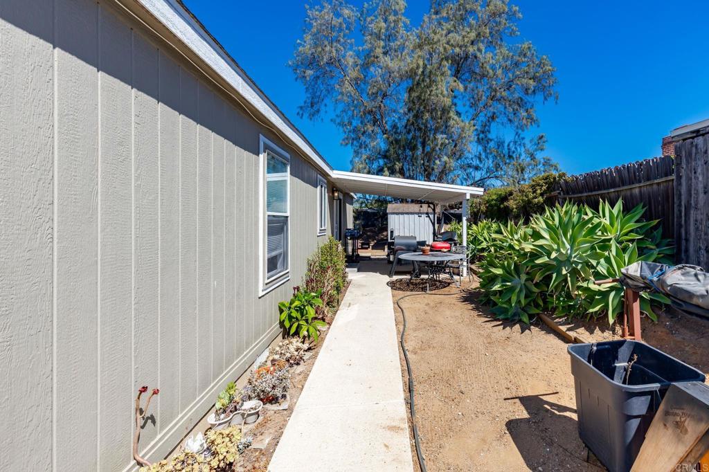 224 Astro Court Vista, CA 92083 - Photo 39 of 47 a patio with table and chairs and potted plants