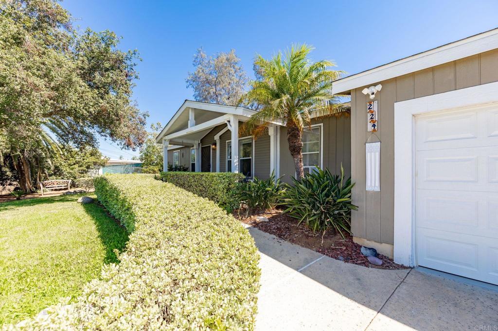 224 Astro Court Vista, CA 92083 - Photo 6 of 47 a front view of a house with a yard