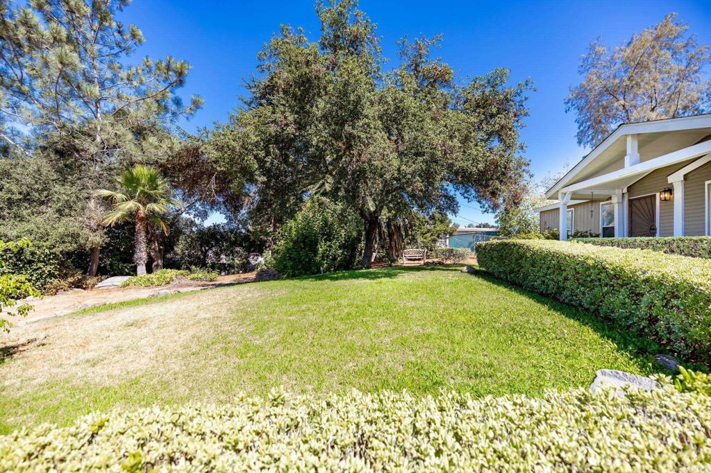224 Astro Court Vista, CA 92083 - Photo 9 of 47 a view of a house with a yard and garage