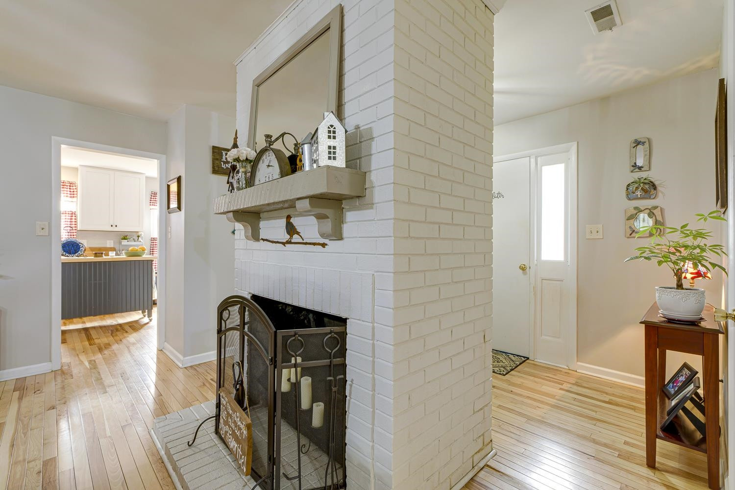 903 Buckhorn Road Garner, NC 27529 - Photo 3 of 15 Stunning brick, walk around fireplace at the entryway. Entryway/Foyer