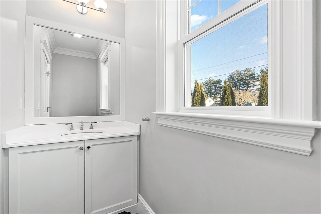 25 Cavanaugh Path Newton, MA 02459 - Photo 11 of 31 a bathroom with a sink and a mirror