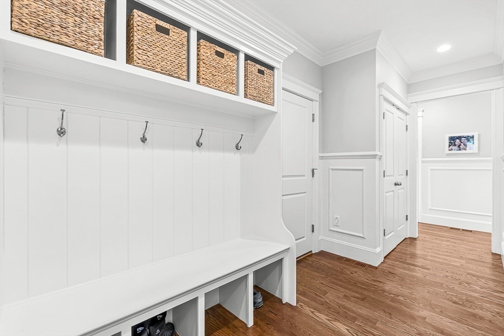 25 Cavanaugh Path Newton, MA 02459 - Photo 12 of 31 a view of a room with wooden floor and cabinet
