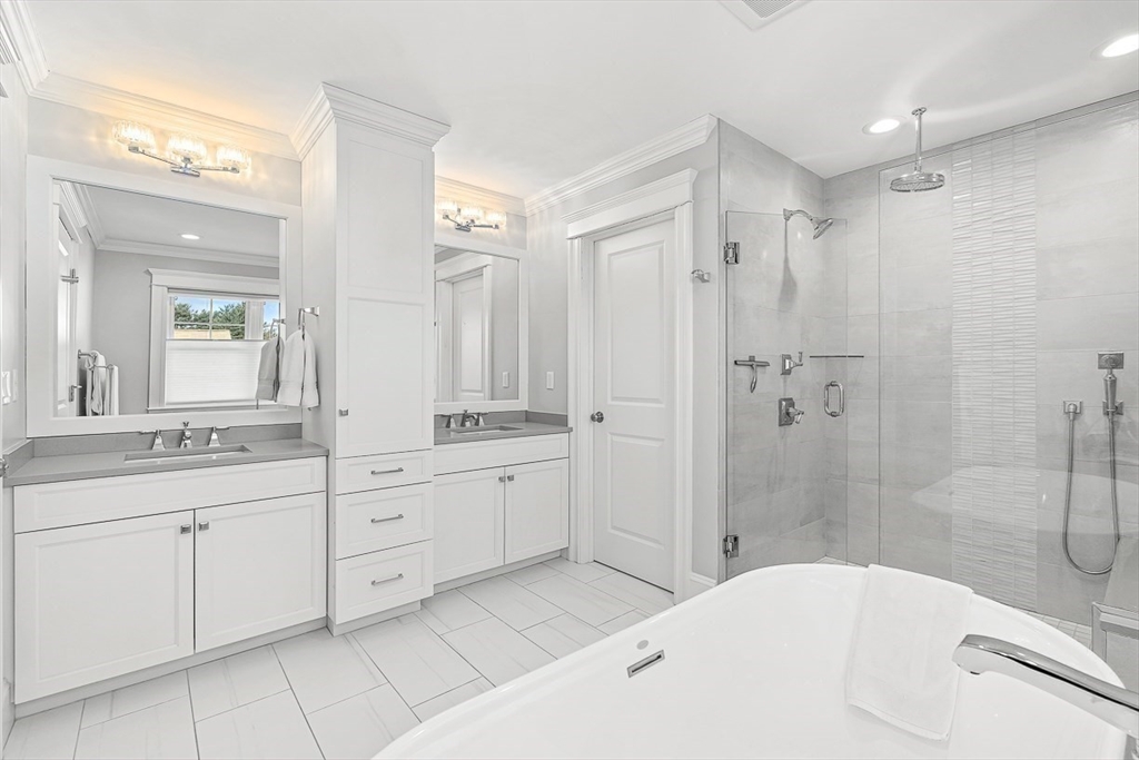 25 Cavanaugh Path Newton, MA 02459 - Photo 16 of 31 a bathroom with a tub sink shower double vanity