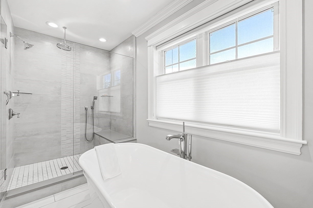 25 Cavanaugh Path Newton, MA 02459 - Photo 17 of 31 a bathroom with a bathtub and a shower