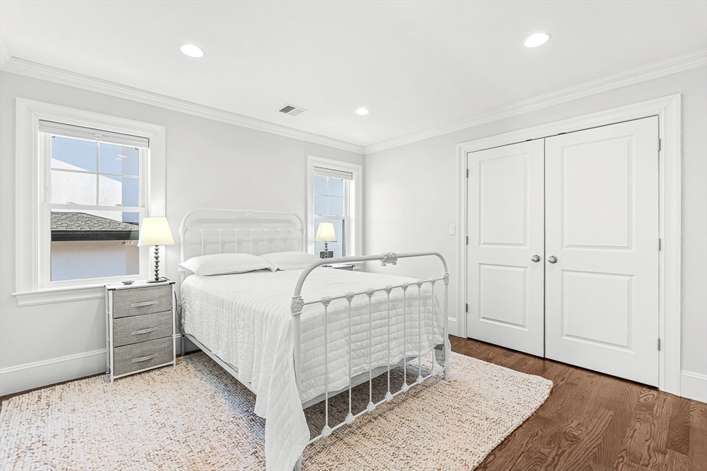 25 Cavanaugh Path Newton, MA 02459 - Photo 20 of 31 a bedroom with a bed and a window