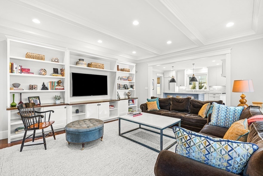 25 Cavanaugh Path Newton, MA 02459 - Photo 3 of 31 a living room with furniture and a flat screen tv
