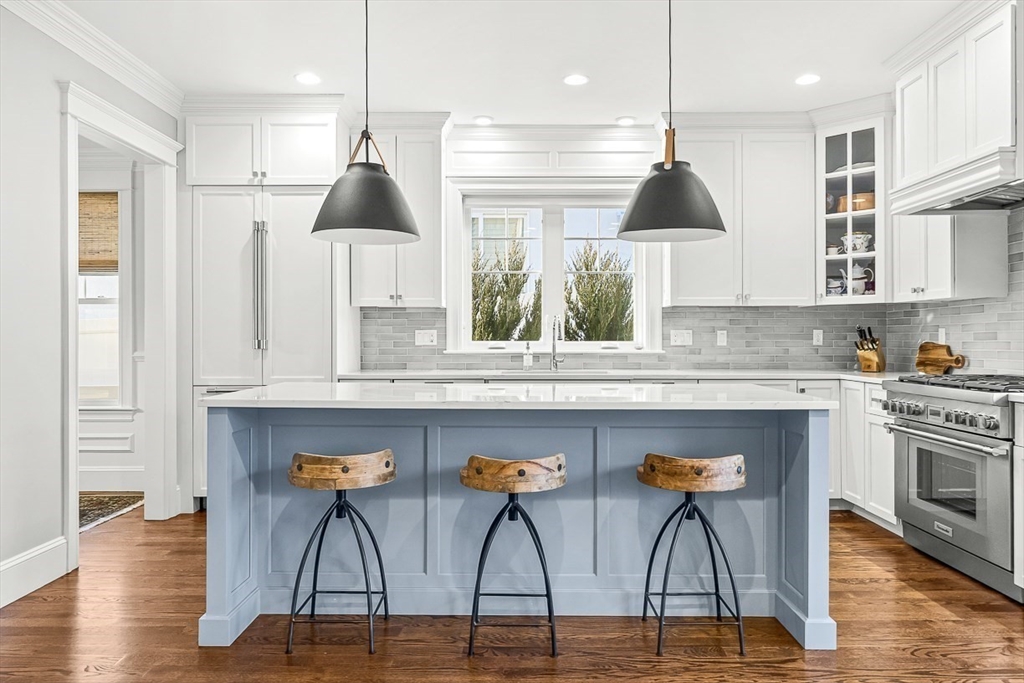 25 Cavanaugh Path Newton, MA 02459 - Photo 6 of 31 a kitchen with stainless steel appliances granite countertop a stove a sink and a refrigerator