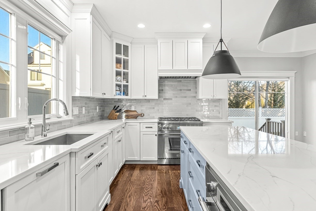 25 Cavanaugh Path Newton, MA 02459 - Photo 8 of 31 a kitchen with a sink stove and cabinets
