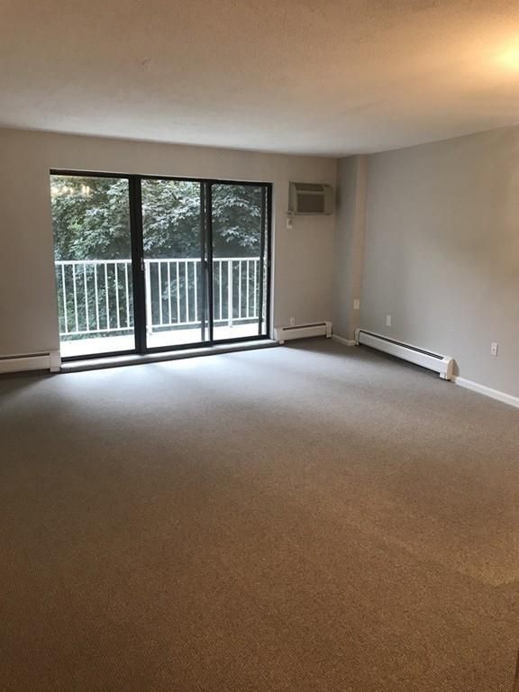 a view of an empty room with a balcony