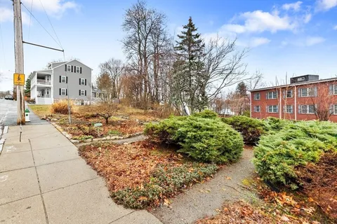 a view of a pathway with a yard