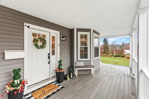 a view of front door deck and patio