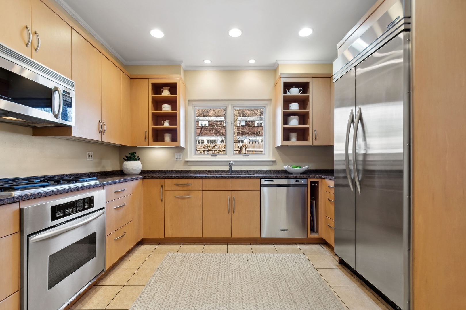 618 Ridge Road Winnetka, IL 60093 - Photo 16 of 29 a kitchen with stainless steel appliances granite countertop a refrigerator oven a sink and dishwasher