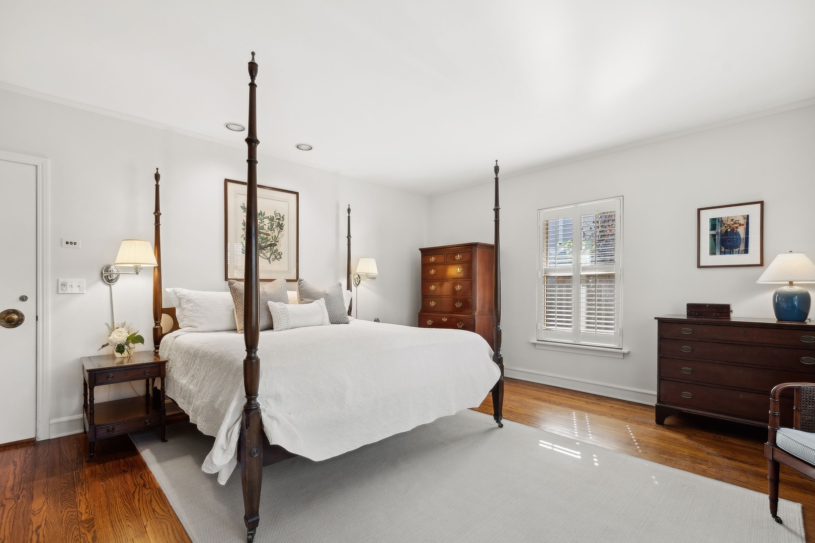 618 Ridge Road Winnetka, IL 60093 - Photo 18 of 29 a spacious bedroom with a bed a dresser and a window