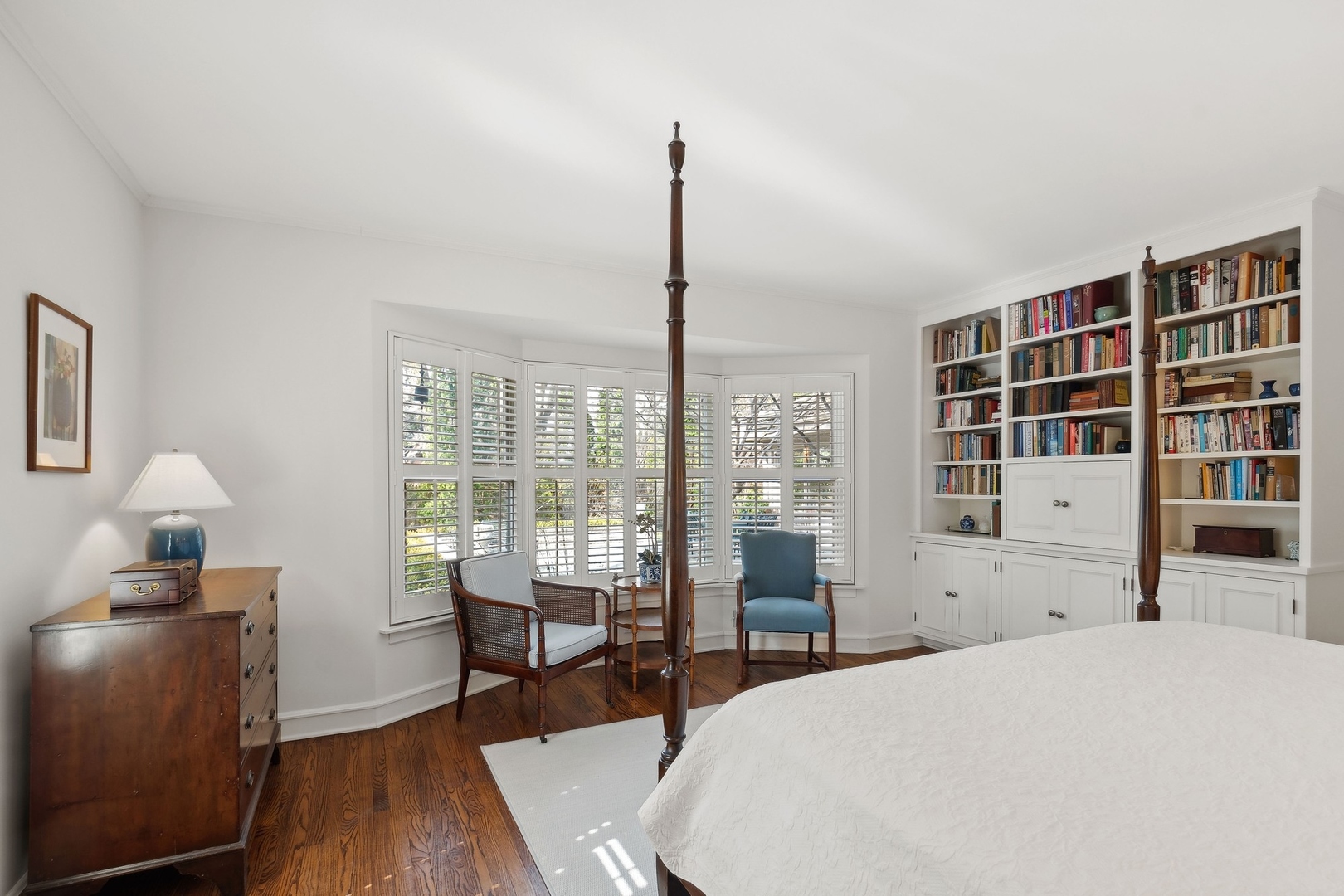 618 Ridge Road Winnetka, IL 60093 - Photo 19 of 29 a bedroom with a bed and wooden floor