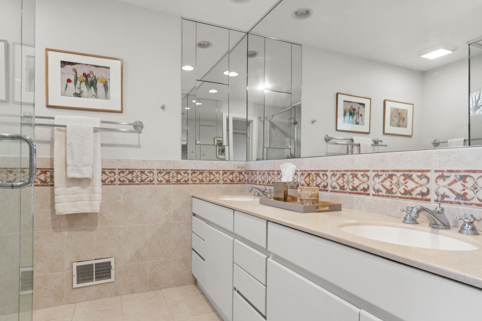 618 Ridge Road Winnetka, IL 60093 - Photo 20 of 29 a bathroom with a double vanity sink mirror and double
