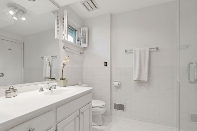 a bedroom with a bed and a table