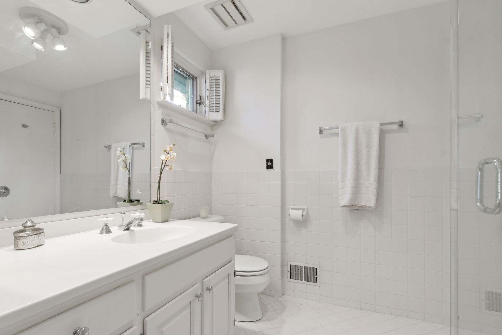 618 Ridge Road Winnetka, IL 60093 - Photo 22 of 29 a bathroom with a double vanity sink toilet and shower