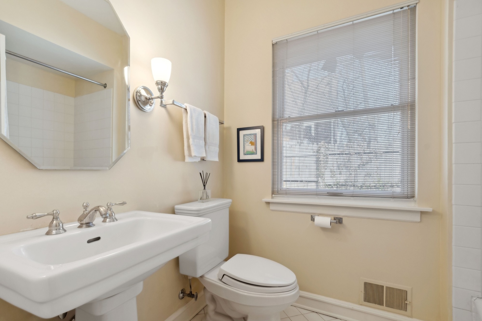 618 Ridge Road Winnetka, IL 60093 - Photo 26 of 29 a bathroom with a sink a toilet and a mirror