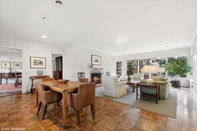 a living room with furniture and a book shelf