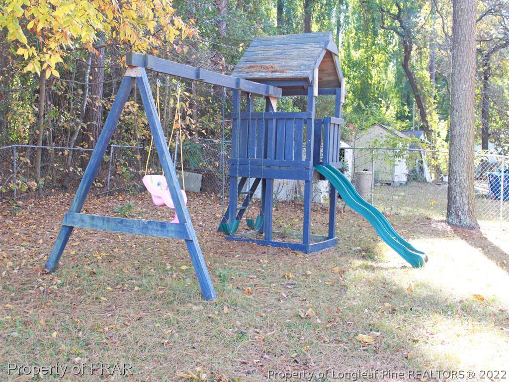 7621 Decatur Drive Fayetteville, NC 28303 - Photo 14 of 15 a view of wooden deck and a backyard