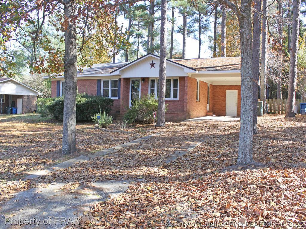 7621 Decatur Drive Fayetteville, NC 28303 - Photo 2 of 15 a front view of a house with a yard
