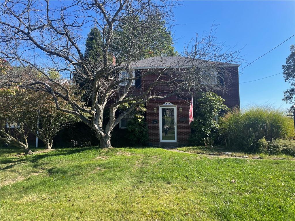 a view of a house with a tree