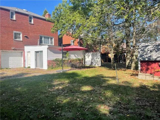 a view of a park with large trees