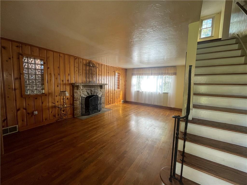 1018 Grandview Avenue Pittsburgh, PA 15237 - Photo 4 of 29 a view of a livingroom with wooden floor fireplace and windows