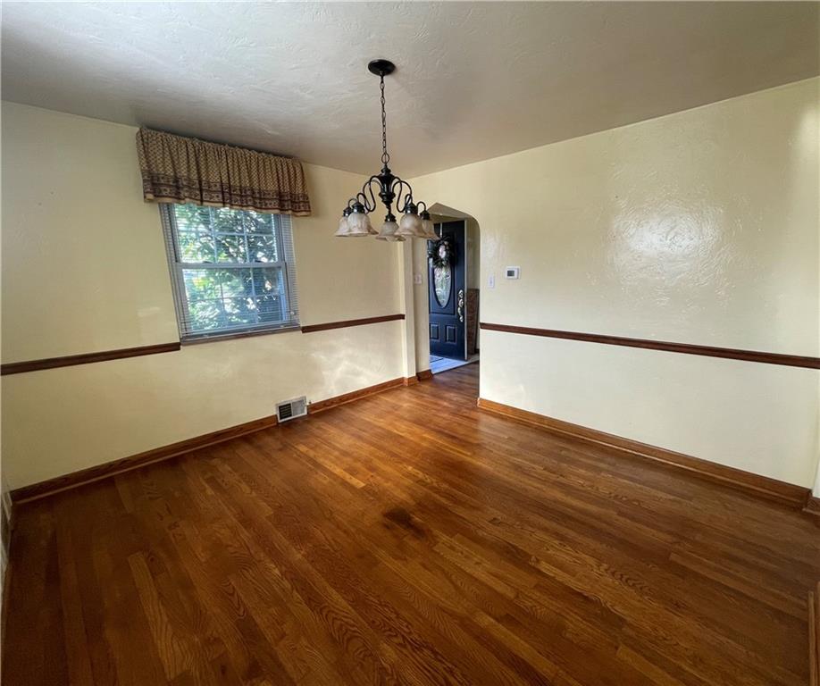1018 Grandview Avenue Pittsburgh, PA 15237 - Photo 8 of 29 a view of a room with wooden floor and a ceiling fan